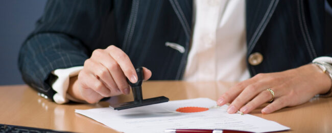 businesswoman stamping document
